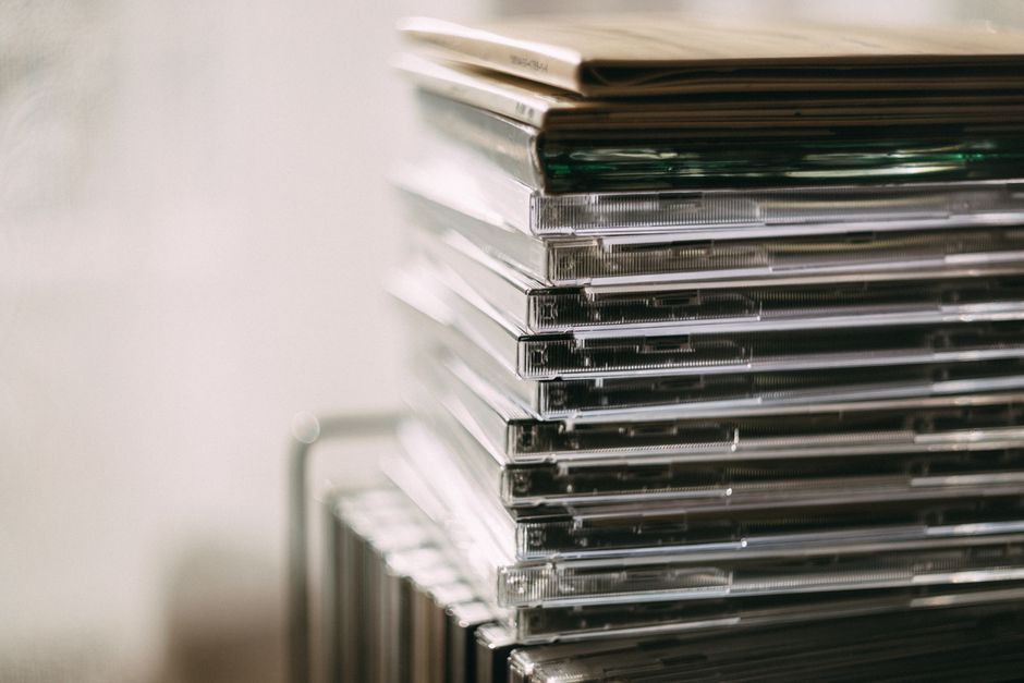 A neat stack of standard letter-sized printer paper next to an office printer