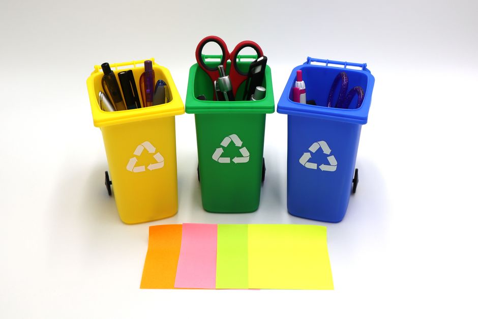 What Size is Normal Printer Paper? A Complete Dimensions & Troubleshooting Guide 3 An office recycling bin containing an old printer, next to a new printer box ready for setup